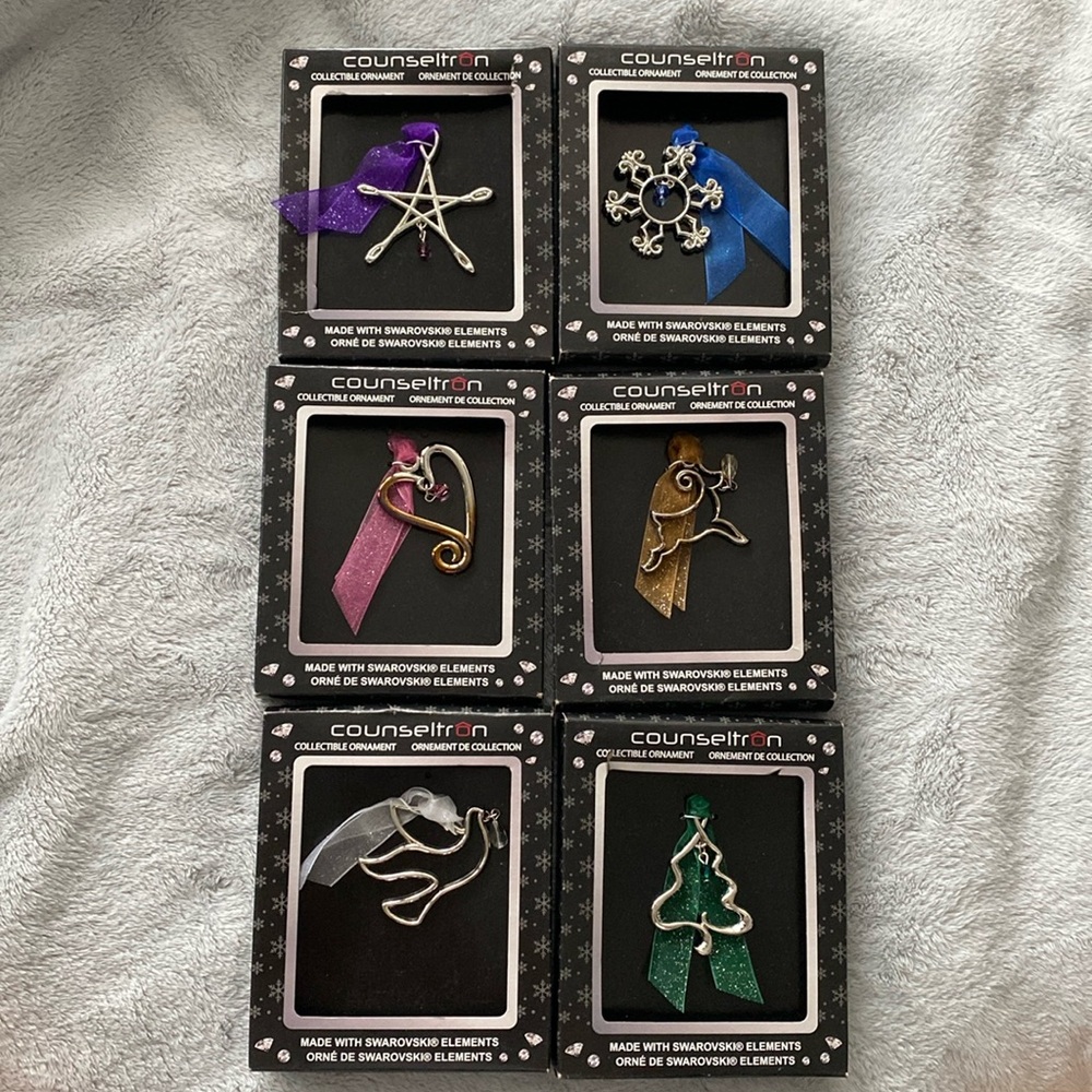 Collectible ornaments made with Swarovski elements. Tarnish free.
